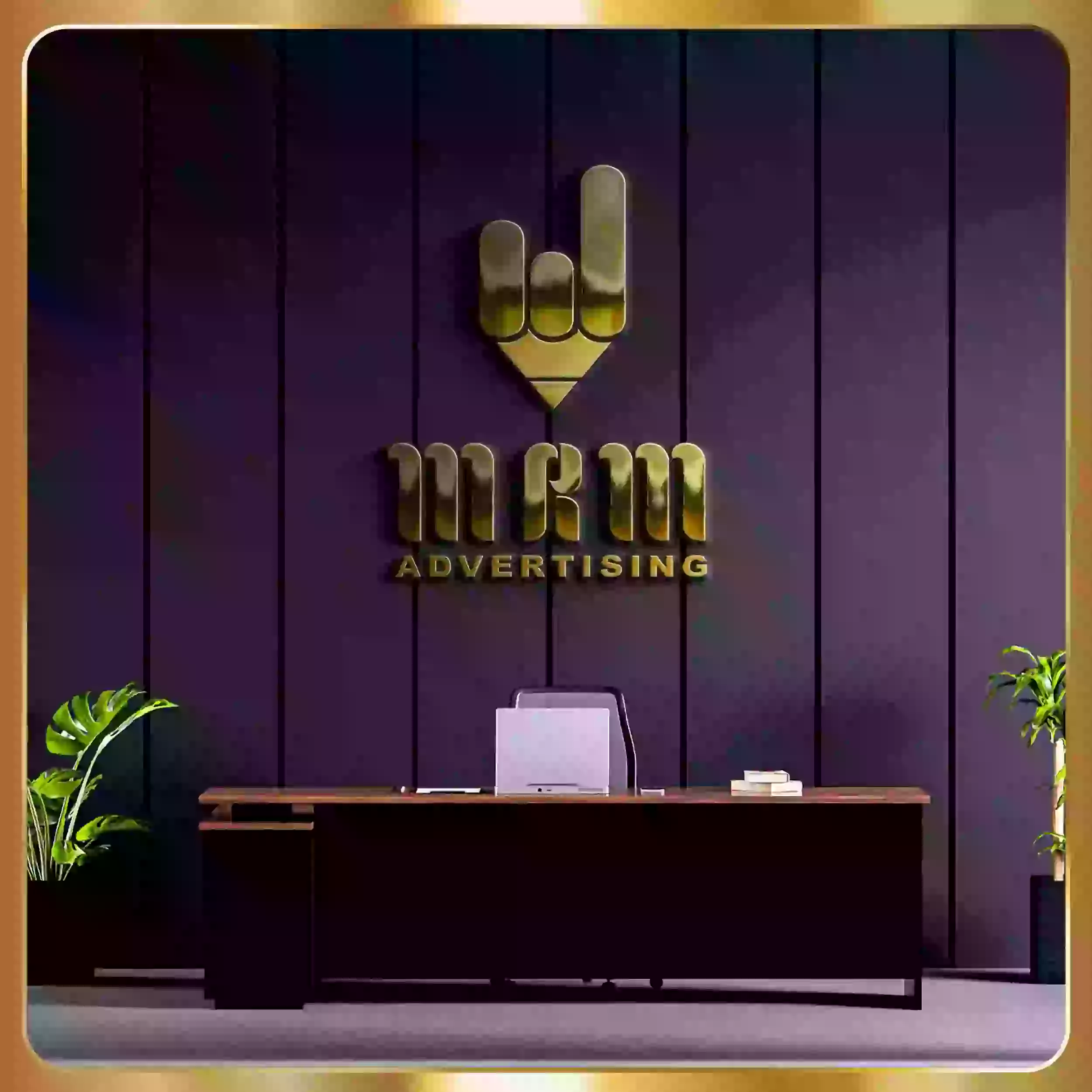 The logo for design advertising is on a desk in a room.